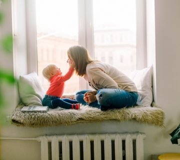 Baby touching woman s face 1257110 360x320
