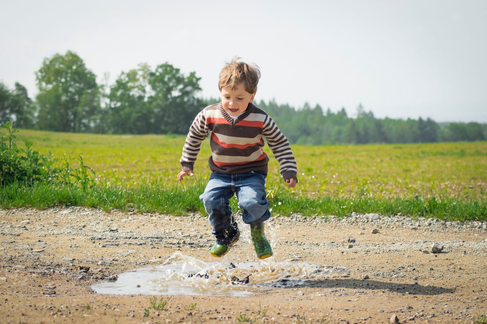 Boy jumping near grass at daytime 1104014 1 scaled