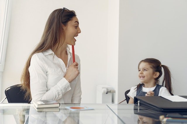 Cheerful woman and kid having fun in office 4149077