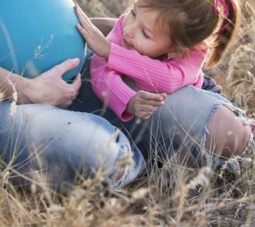 Child touching his mother lamb 160624 360x320