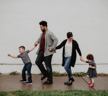 Family of four walking at the street 2253879 360x320