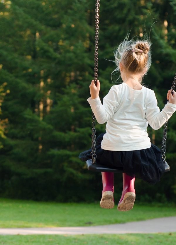 Girl in white long sleeve shirt and black skirt sitting on 12165 1 600x837