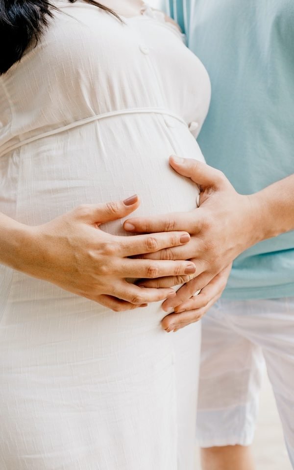 Photo of hands touching baby bump 4513731 1 600x960